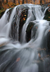 Asi 1 m vysoký vodopád na spodním toku Malého (Bílého) Štolpichu v národní přírodní rezervaci Jizerskohorské bučiny. Na horním toku se pak nachází větší vodopád v kamenné suti. Název potoka se odvozuje od okolních štol, ve kterých se v minulosti těžila železná ruda.

