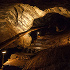 Chýnovské jeskyni se trefně přezdívá Malovaná jeskyně, protože vyniká barevností stěn a stropů – střídají se tu vrstvy tmavozelených amfibolitů s bělostnými, žlutými a hnědými partiemi mramorů. Jeskynní systém je dlouhý přes 1 200 m. Národní přírodní památka.

